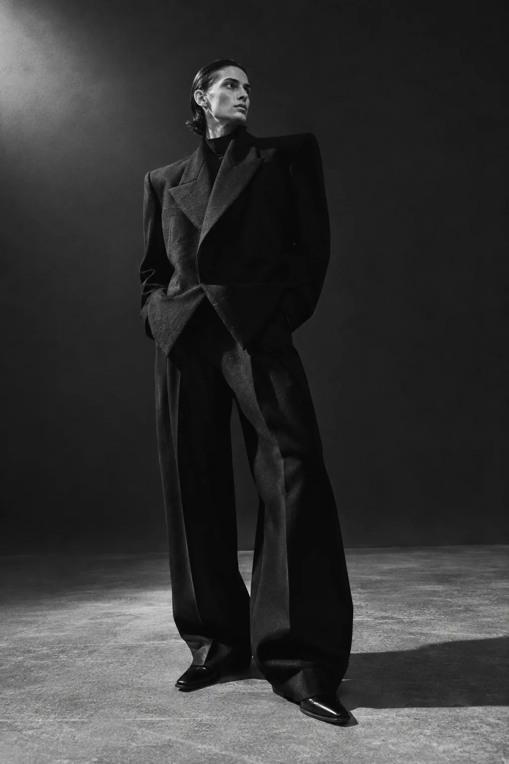 Angular black wool jacket and wide-leg trousers